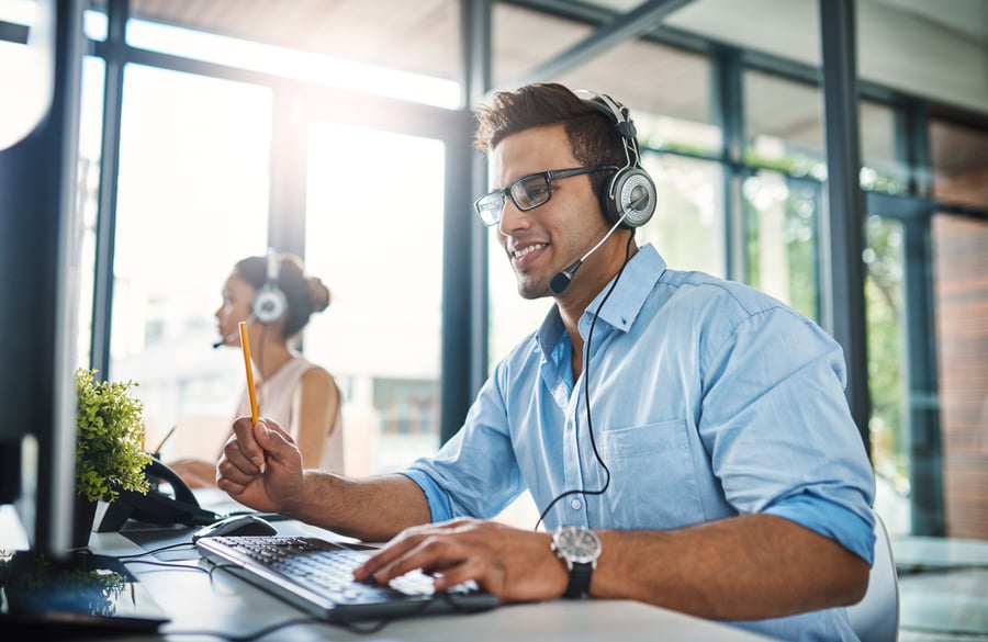 High-performing male employee working a customer service job