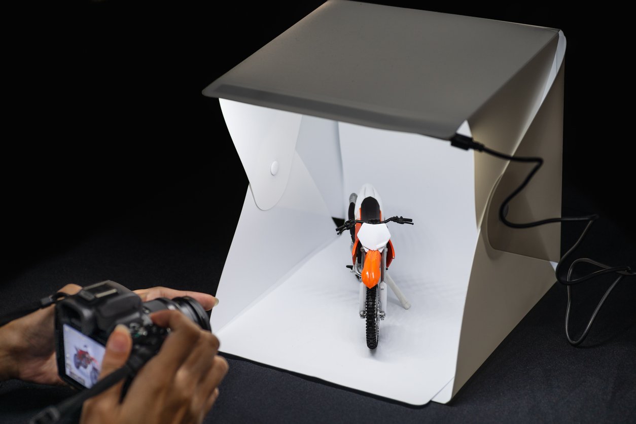 This designer end table also functions as a Lightbox for product photography:  Digital Photography Review