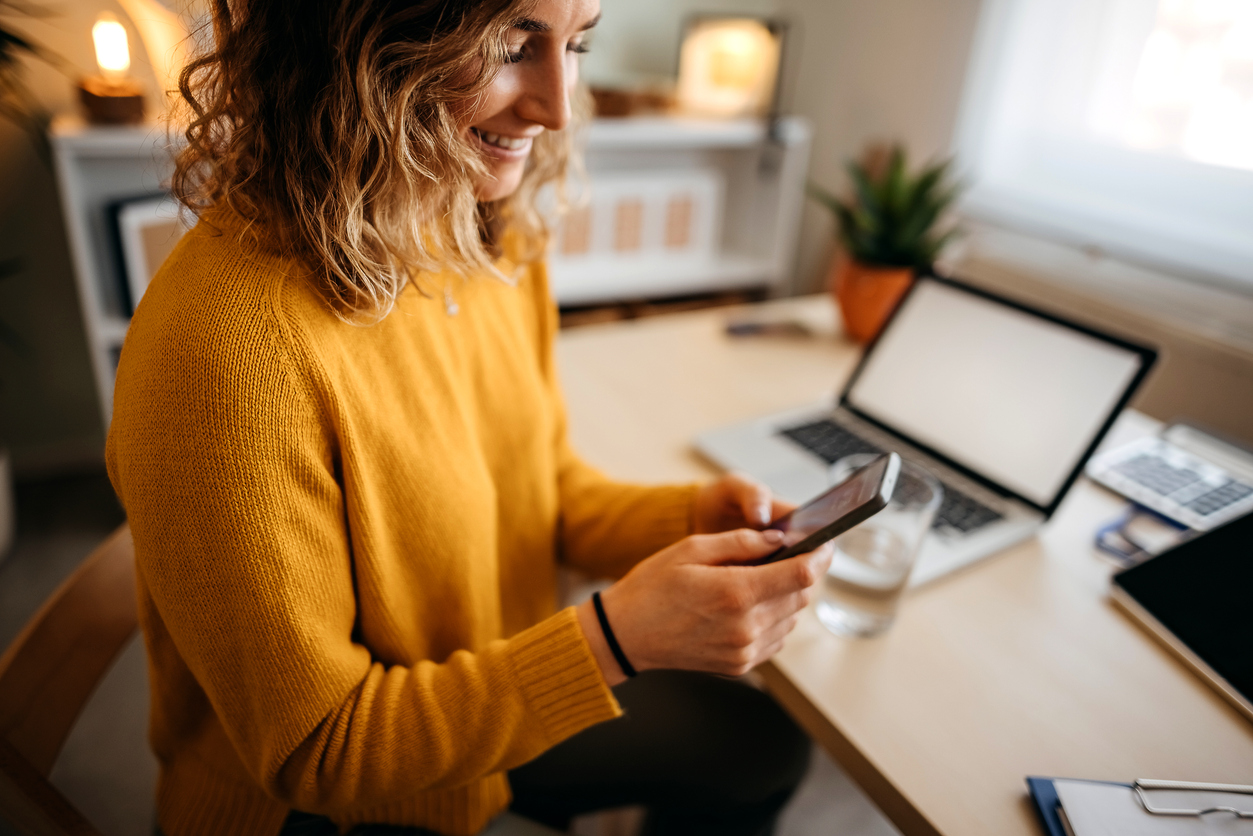 Woman reading an email on her phone