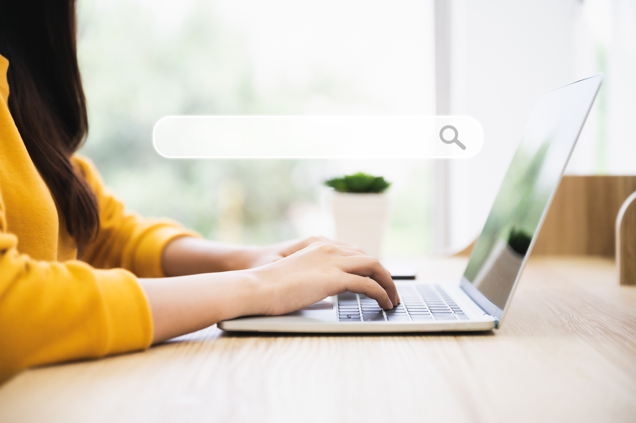 Woman using a search engine on a laptop